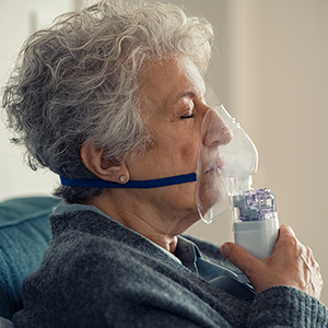 Older woman wearing oxygen mask