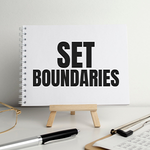 Sign on desk reading &quot;Set Boundaries&quot;