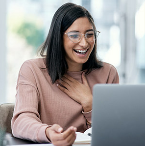 woman having a happy conversation over a virtual meeting