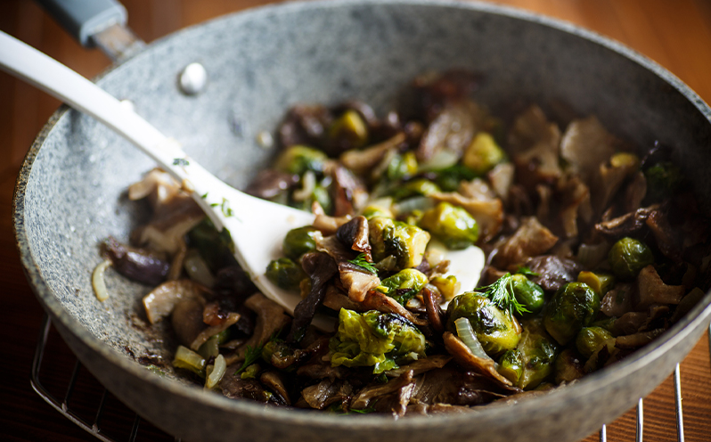 brussel sprouts with mushrooms in a pan